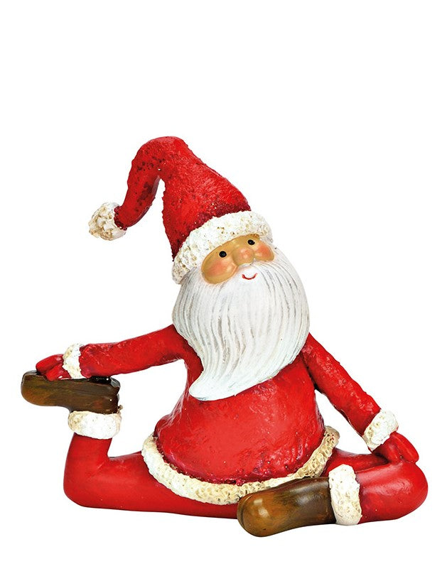 Yoga machende Weihnachtsmänner 